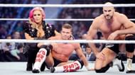 Kidd, with wife Natalya, and Cesaro, whom he held the Tag Team Titles with.